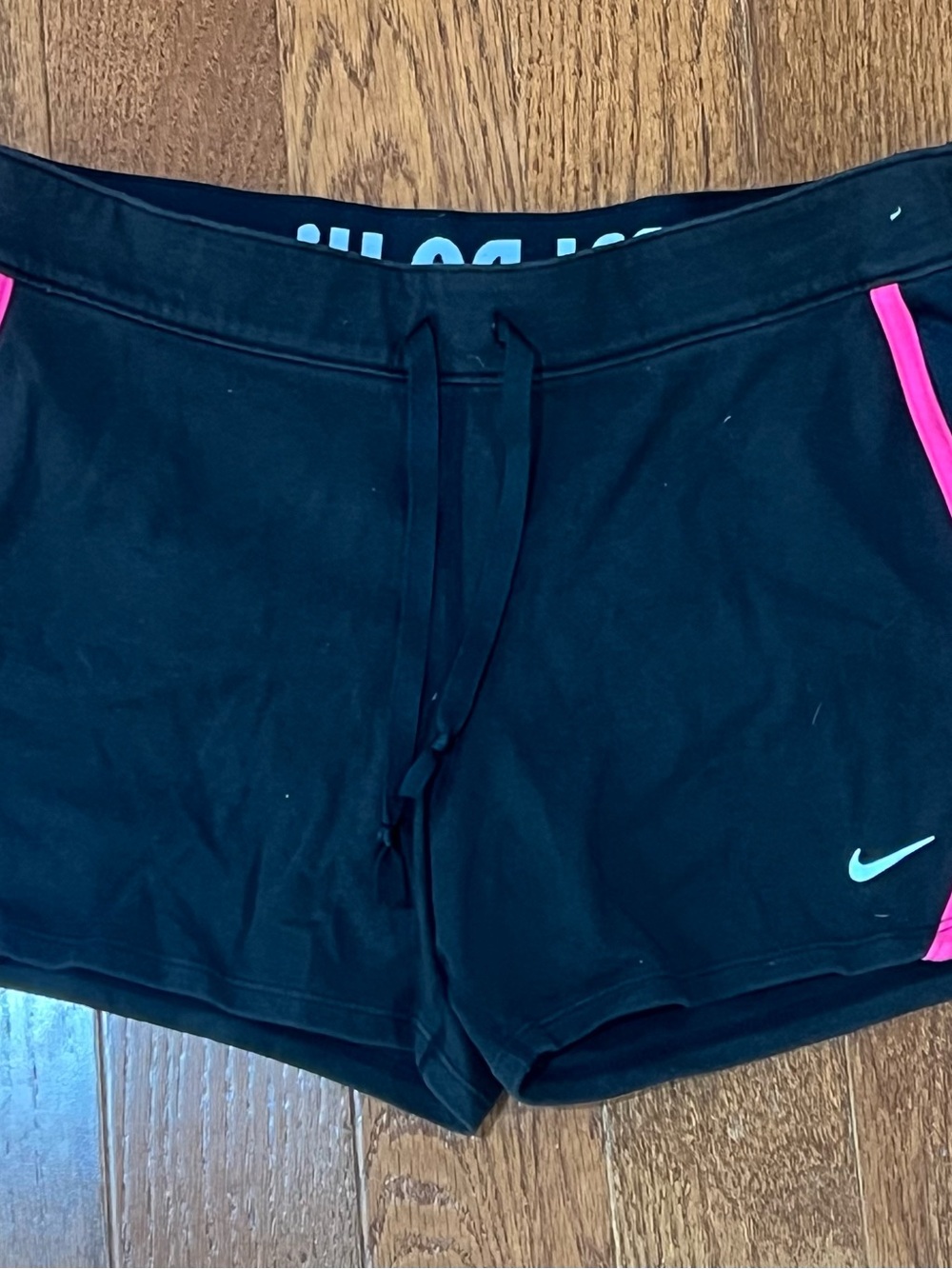 Nike Black Women's Athletic Shorts with Pink Accents and Teal Swoosh